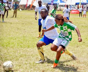 A Case Hospital Player challenges a URA player for the ball during thr forst outing